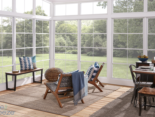 A patio enclosure adds to the exterior beauty of this countryside home.